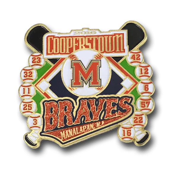 A decorative trading pin featuring Cooperstown in red at the top, a large M on a baseball in the center, and Braves and Manalapan, NJ at the bottom. Two crossed bats and baseball icons with numbers enhance this collectible design.