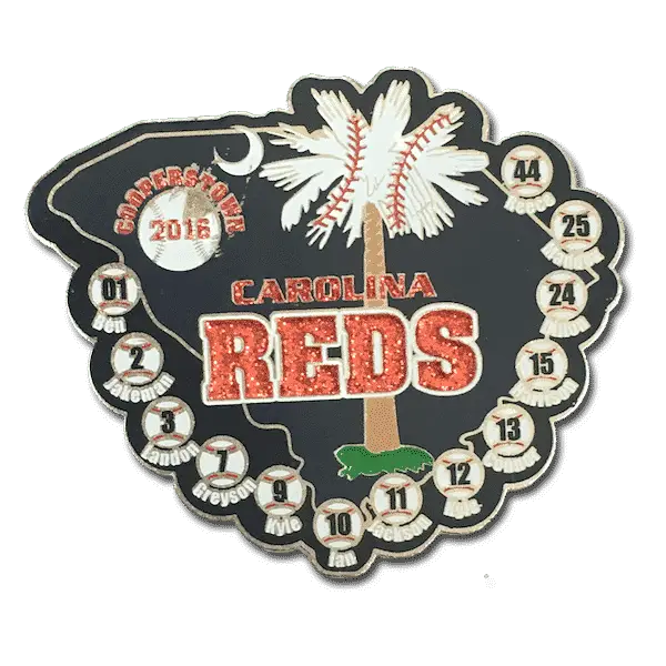 Baseball trading pin shaped like South Carolina, white palmetto, CAROLINA REDS in red glitter, Cornerstone 2016, numbered baseballs.
