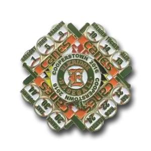 A baseball pin from Cooperstown 2016, featuring the Elkridge Baseball logo at the center. It includes ten circular sections with player names and numbers, arranged around the center.