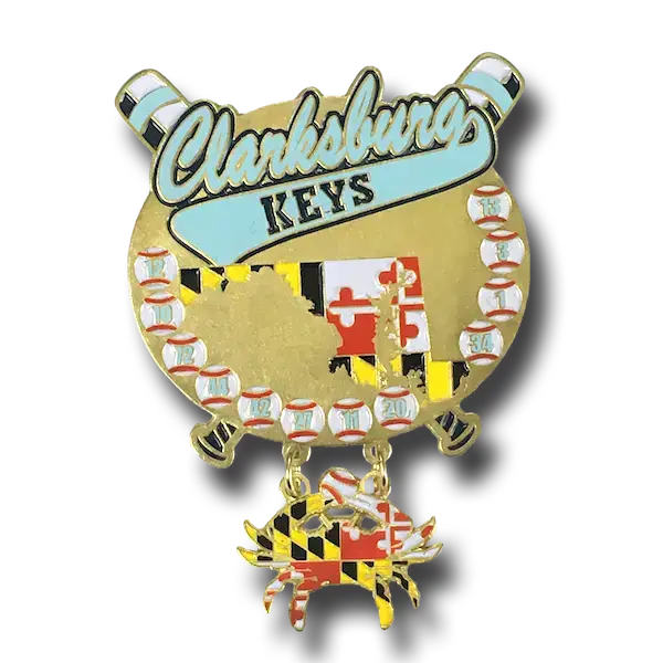 Gold lapel pin featuring the text Clarksburg Keys with baseball graphics and the outline of Maryland adorned with its flag pattern. A dangling crab charm also bears the Maryland flag design.