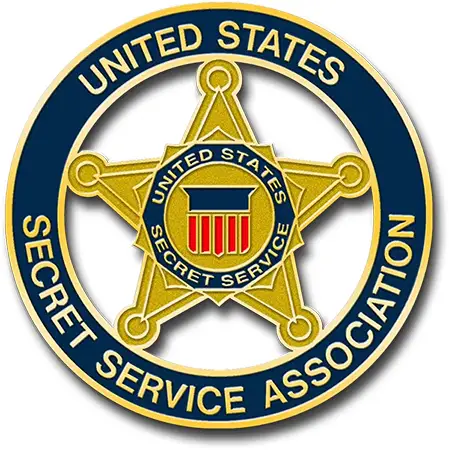 Emblem of the United States Secret Service Association, showcasing a gold star with a red, white, and blue shield in the center. Encircled by United States Secret Service Association on a blue background, its reminiscent of custom-made coins treasured for their unique design.