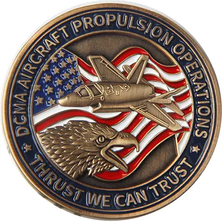A circular, custom-made medal showcasing an eagles head and a military aircraft against the backdrop of the American flag. The border reads DCMA AIRCRAFT PROPULSION OPERATIONS and THRUST WE CAN TRUST.