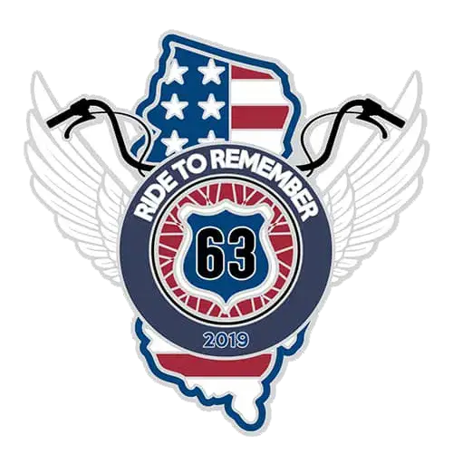 A badge design featuring a map shape with the U.S. flag pattern inside, surrounded by wings. A circular emblem in front reads Ride to Remember and 63 with ribbons and 2019 at the bottom.