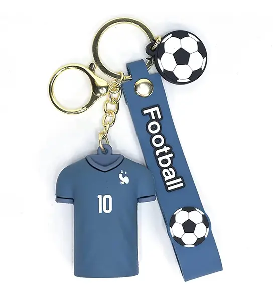 Custom made keychain with a blue soccer jersey charm featuring the number 10, a rubber strap embossed with Football, and a hanging soccer ball charm.