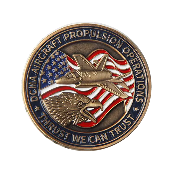 A commemorative coin with DCMA Aircraft Propulsion Operations and Thrust We Can Trust inscribed. Featuring an eagle, jet, and American flag on a bronze background, its crafted with precision akin to the artistry of Cooperstown Pins.
