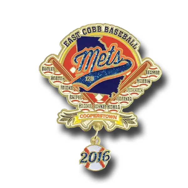 A decorative soft enamel pin for East Cobb Baseball showcases the Mets logo over a U.S. map, adorned with names like Butler, Horton, and Snipes. A baseball charm inscribed with 2016 dangles below, all set against a backdrop of stars and stripes.